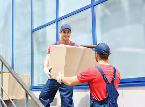 Boxes and household belongings organized in Chessington storage space
