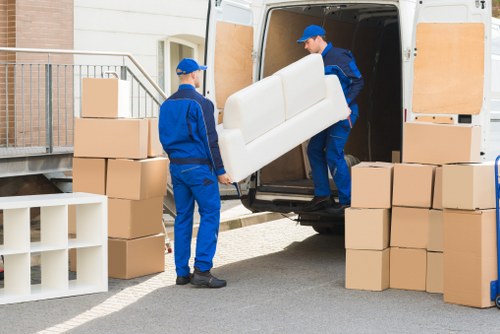 Staff following safe storage procedures in a warehouse setting
