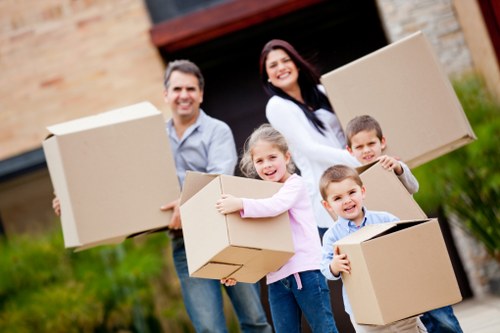 Family home moving boxes and furniture prepared for removals in Chessington