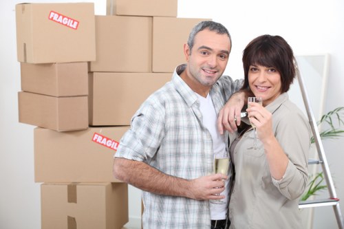 Professional movers loading furniture for a local removal in Chessington